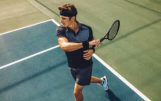 Tennis player practicing forehands