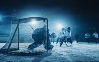 Ice Hockey Rink Arena: Goalie against Forward Player who Does Slapshot, Shots Puck with Stick and Scores Goal. Forwarder against Goaltender.