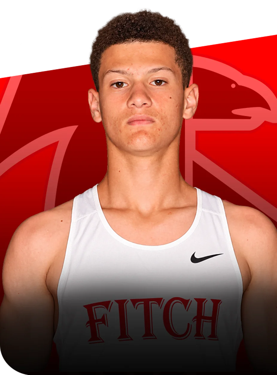 Portrait of Daimon Flax wearing a white Fitch team jersey against a red background featuring a stylized bird logo.